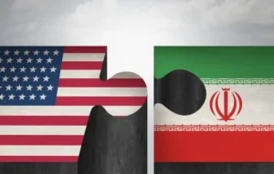 Прапори США та Ірану як незєднані пазли, що символізують розбіжності в переговорах