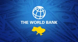 Логотип Світового банку над картою України на тлі доларових банкнот