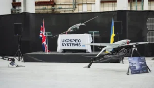 Дрони UKRSPEC SYSTEMS на стенді з прапорами Британії та України