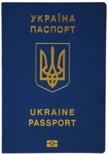 Синяя обложка украинского паспорта с золотым трезубцем и надписями
